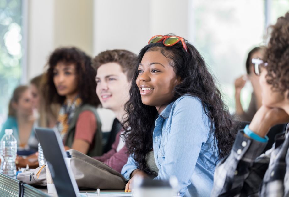 college students in class smiling